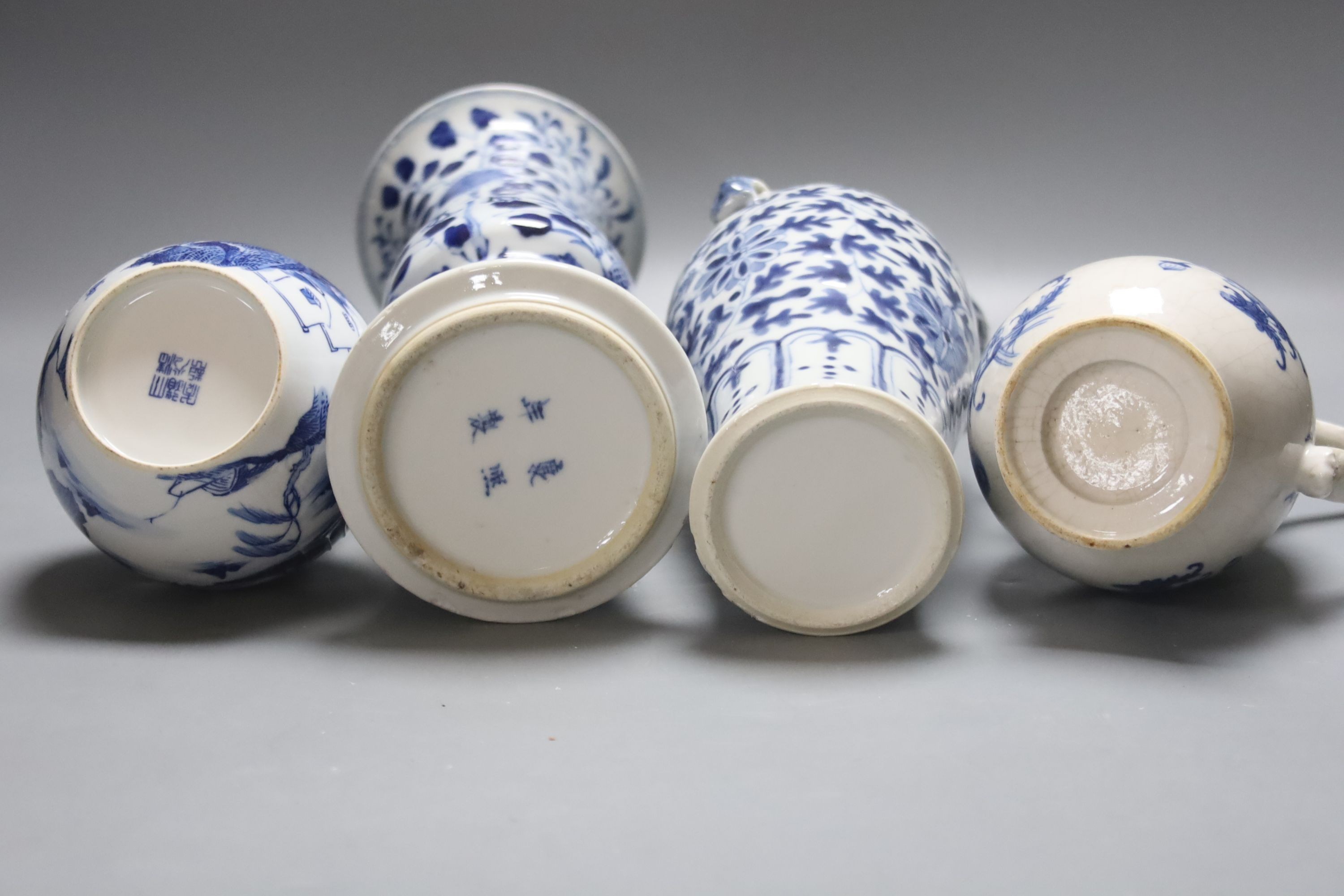 Two 19th century Chinese blue and white vases, an 18th Century blue and white jug and a later jar and cover, tallest 30cm